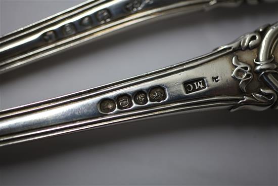 A matched pair of Victorian silver double struck scroll rosette pattern basting spoons, 12.5 oz.